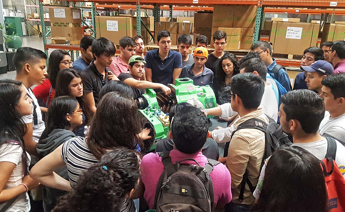 Students in Mexico examining a BITZER compressor