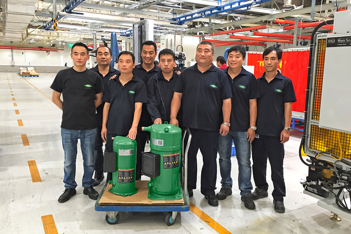 Chinese BITZER employees on the shop floor with ORBIT 6 and 8 scroll compressors
